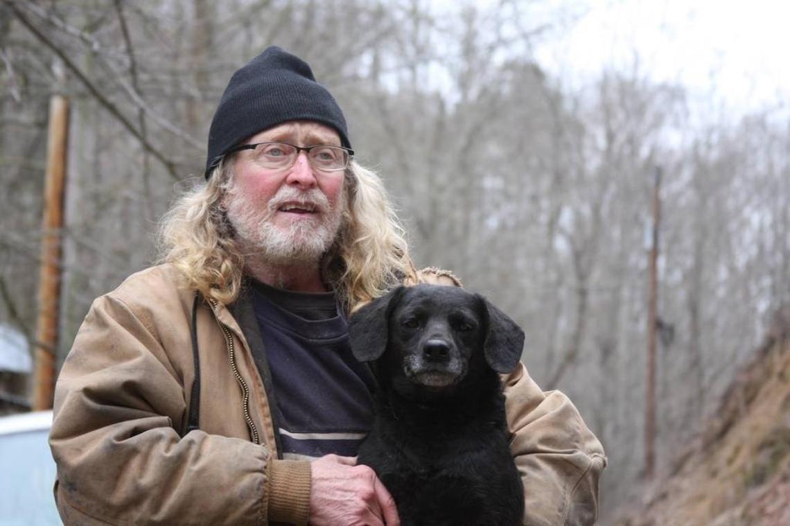 Randy Skaggs, owner and operator of the Trixie Foundation, holds a dog that arrived at the foundation in March, 2018.