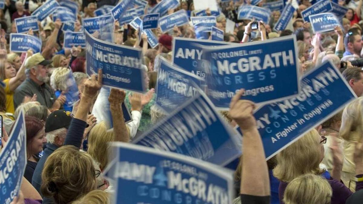 Amy McGrath supporters waved signs during a rally for the Democratic Kentucky 6th Congressional District candidate October 12 in Owingsville.