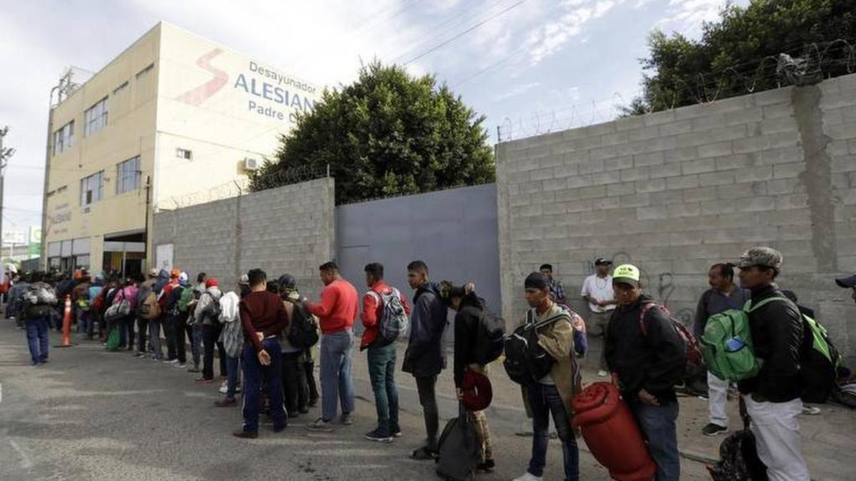Central American migrants waited in line Nov. 14 for a meal at a shelter in Tijuana, Mexico. Migrants traveled in a caravan to reach the U.S. border and apply for asylum.