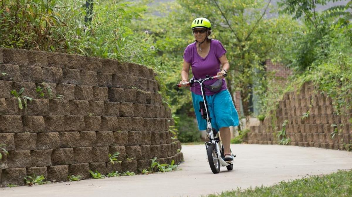 The writer on one of her scooters
