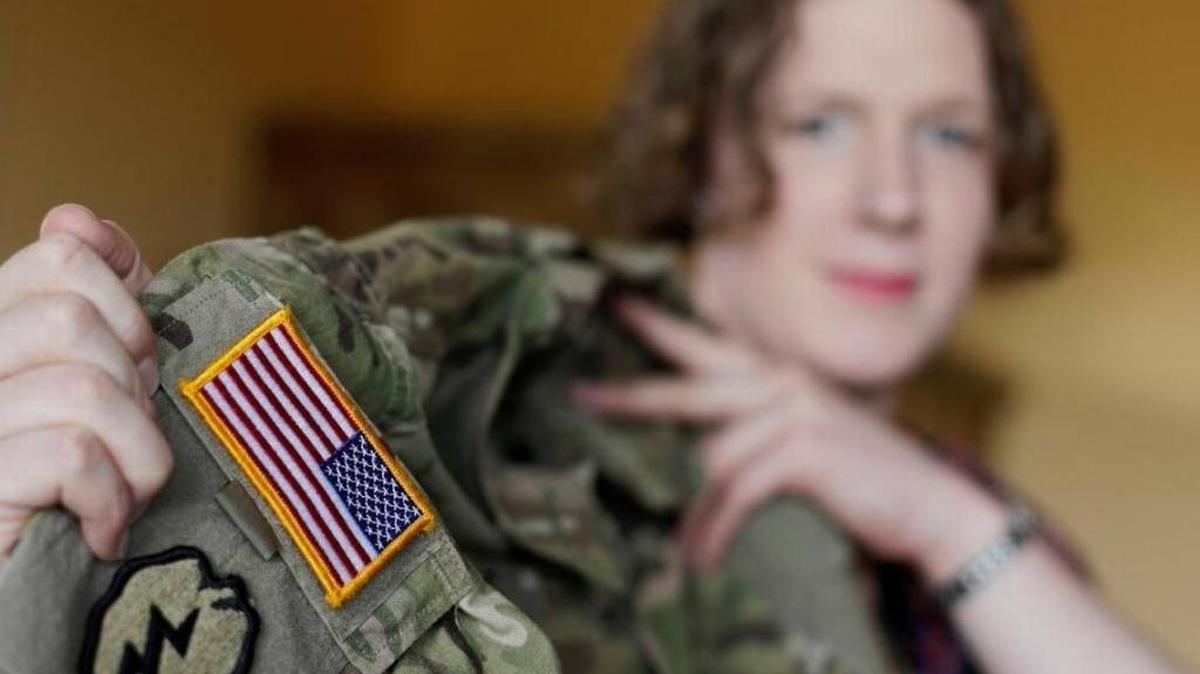 Transgender U.S. Army captain Jennifer Sims lifted her uniform during an August interview in Beratzhausen near Regensburg, Germany.