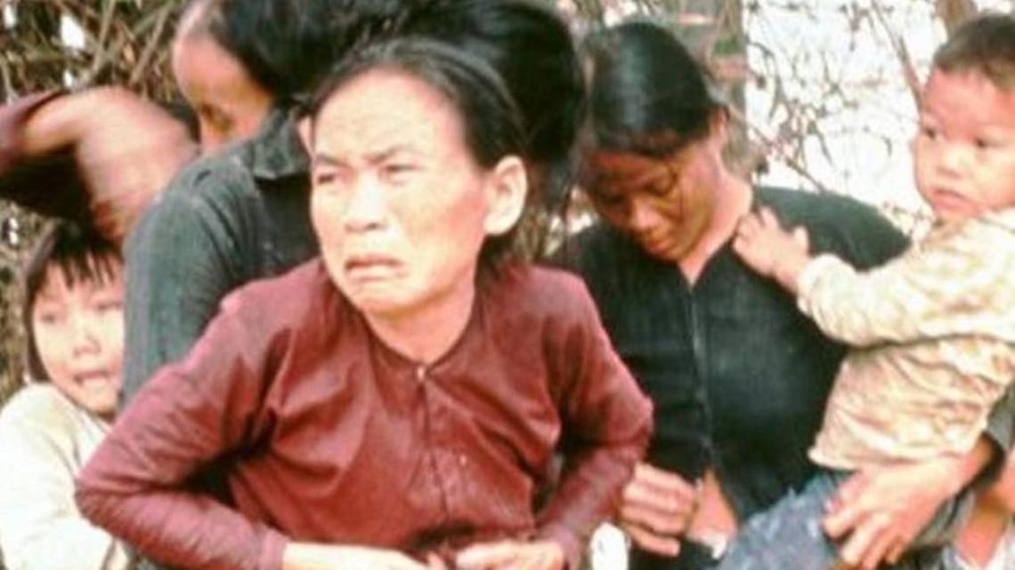 Group of civilian women and children rounded up to be killed moments later by U.S. Army during massacre of village while in pursuit of Vietcong militia.