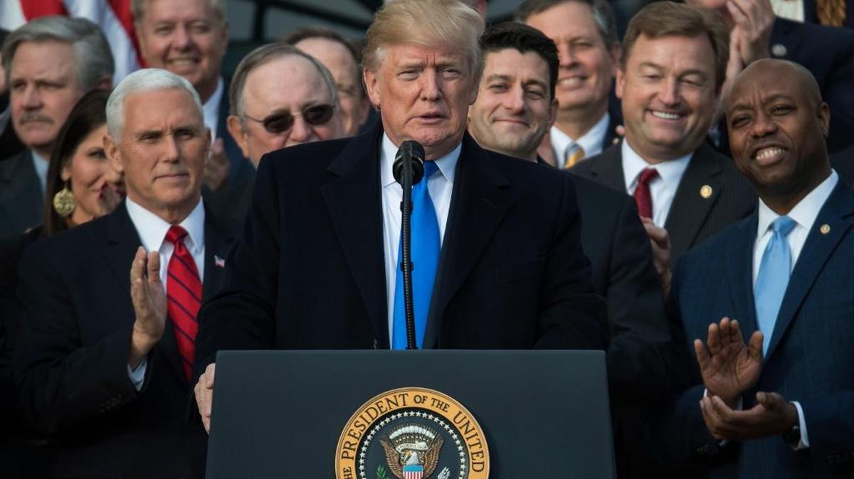 President Donald Trump, joined by Vice President Mike Pence, Speaker of the House Paul Ryan, R-Wis., and other members of Congress, celebrated Dec. 20 final passage of tax overhaul legislation.