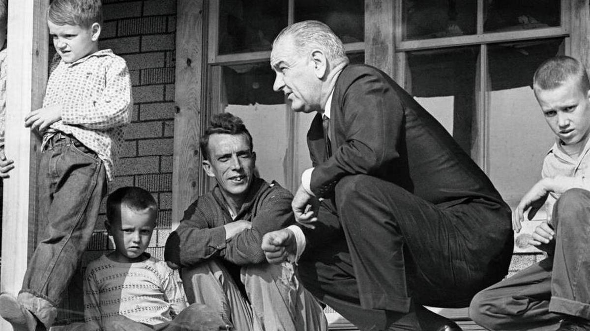 President Lyndon B. Johnson visited Tom Fletcher’s house in Martin County in 1964. Johnson declared a war on poverty that day that led to trillions of dollars in federal spending, largely through benefits programs such as Medicare, Medicaid, public housing and food stamps.