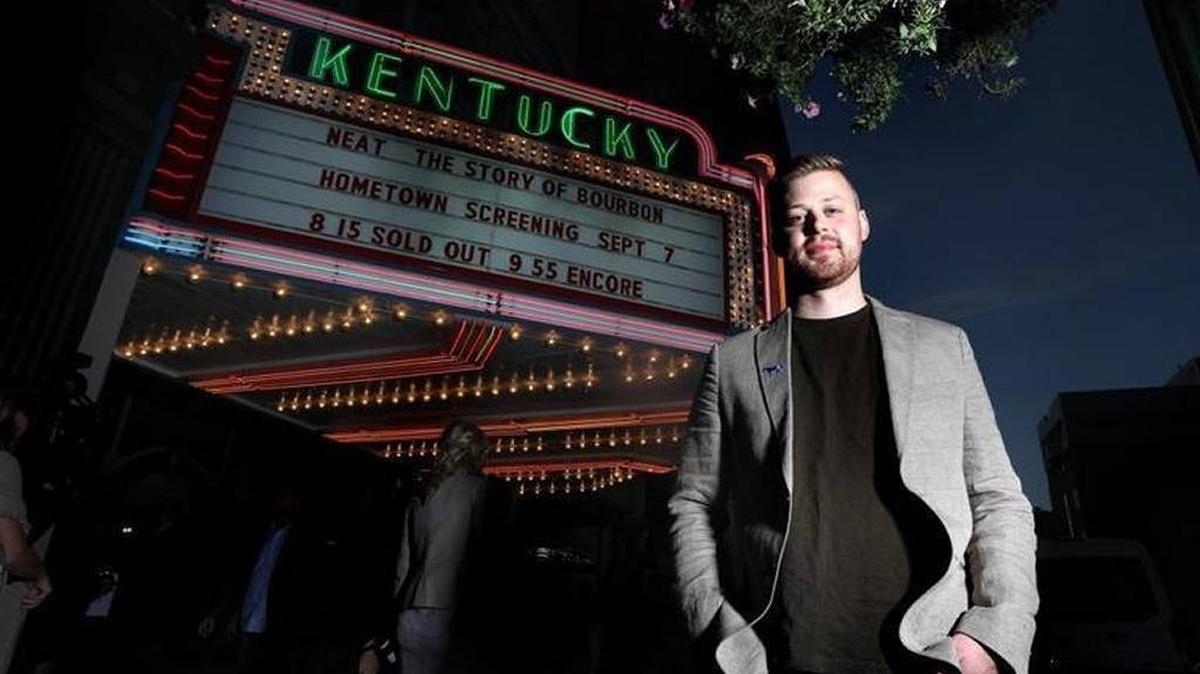 A.J. Hochhalter under the marquee at the Kentucky Theatre prior to a September hometown screening of “Neat,” a documentary he produced about Kentucky’s bourbon industry.