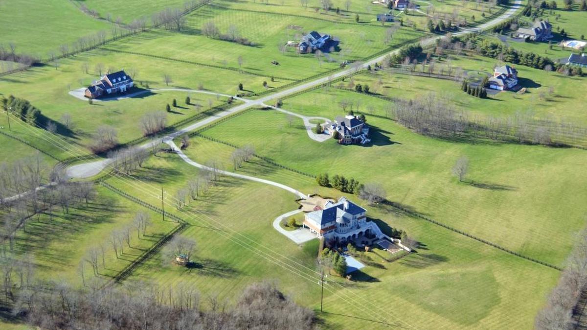 Large residential properties, such as these off Brookmonte Lane in Fayette County, have automatically been getting tax breaks intended for working farms.