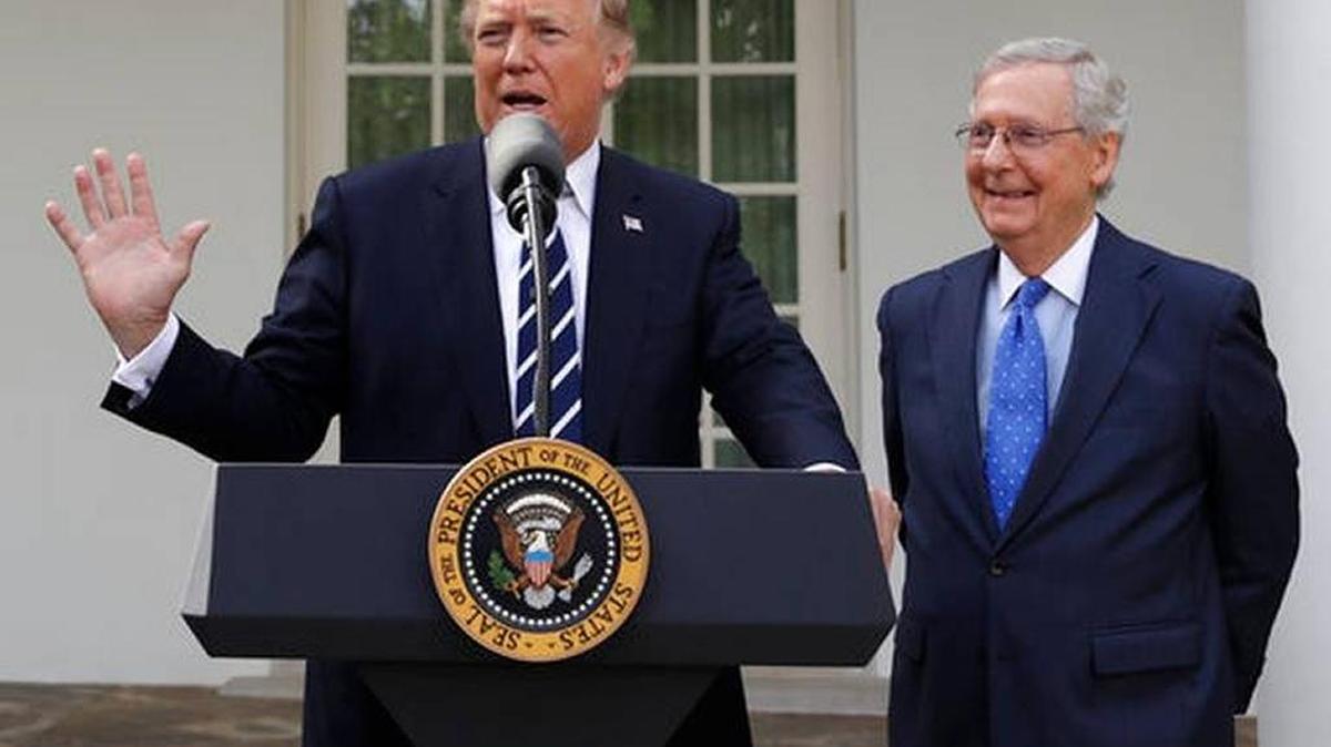 President Donald Trump answers questions with Senate Majority Leader Mitch McConnell, R-Ky., in the Rose Garden after their meeting at the White House, Monday, Oct. 16, 2017, in Washington.