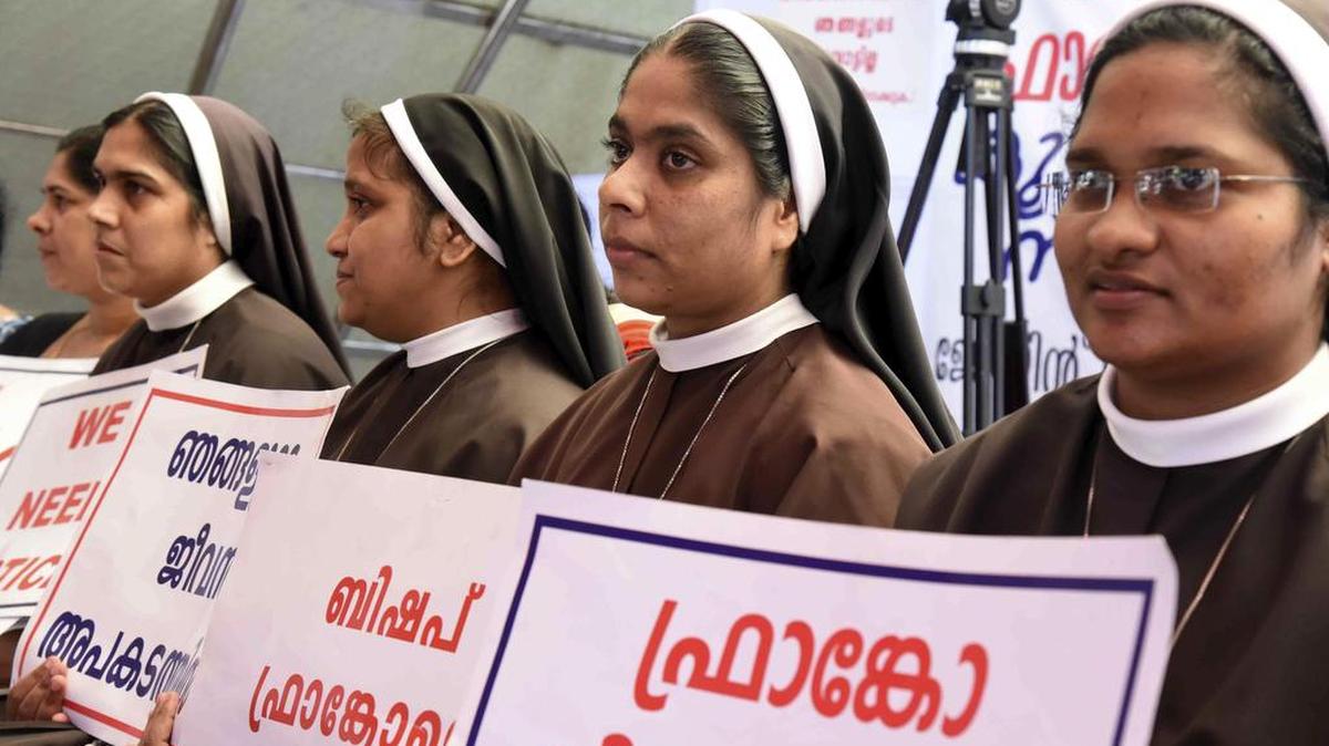 Catholic nuns in India held placards demanding the arrest of a bishop who one nun has accused of rape, during a Wednesday protest. The bishop has denied the accusations.