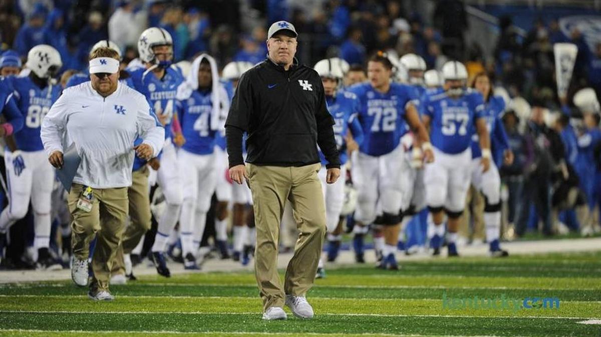 University of Kentucky football coach Rich Brooks leads his team off the field during halftime of the Eastern Kentucky University game in October.