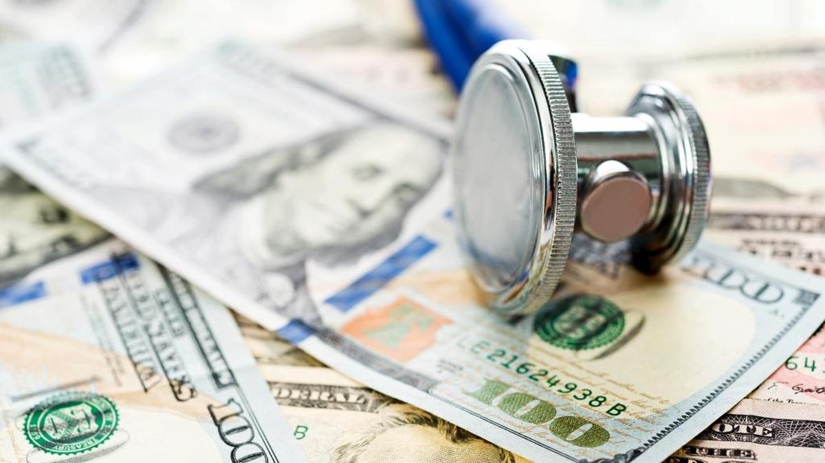 Stethoscope over the dollar bills.