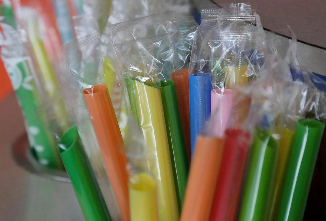 This July 17, 2018 photo shows wrapped plastic straws at a bubble tea cafe in San Francisco. Eco-conscious San Francisco joins the city of Seattle in banning plastic straws, along with tiny coffee stirrers and cup pluggers, as part of an effort to reduce plastic waste. It also makes single-use food and drink side items available upon request and phases out the use of fluorinated wrappers and to-go containers. (AP Photo/Jeff Chiu)