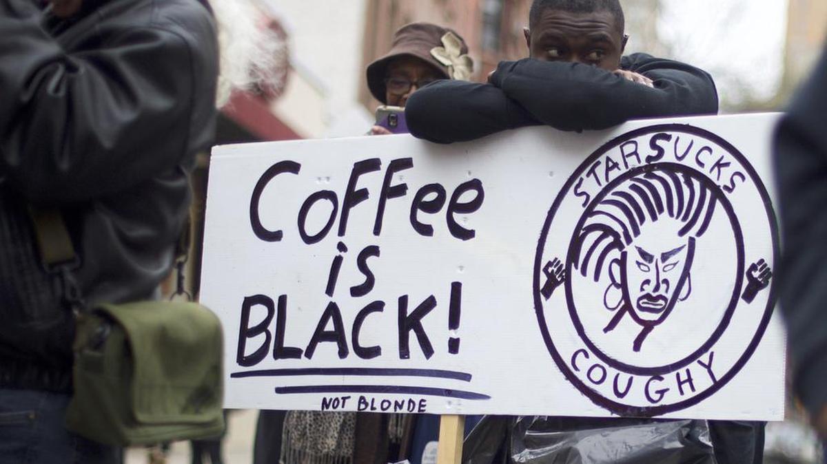 A participant at an April 15 protest at a Philadelphia Starbucks after a manager called police on two black men waiting for a friend to join them. Starbucks later apologized, had diversity training for employees across country.