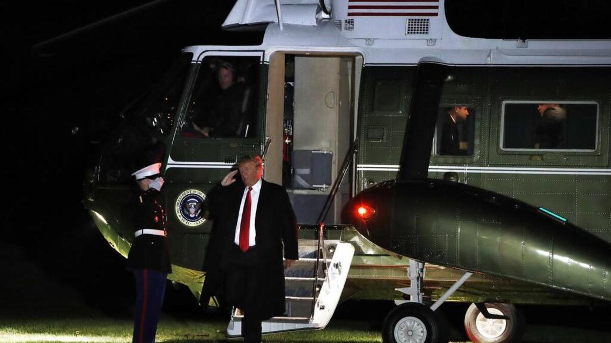President Donald Trump saluted as he exited the Marine One helicopter on return to the White House on Nov. 3, 2018, in Washington, after attending rallies in Montana and Florida.