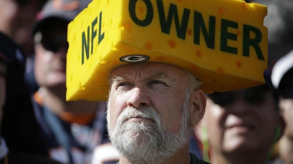 A Green Bay Packers fan, who along with others own a stake in the team, donned a cheesehead during a September game against the Chicago Bears.