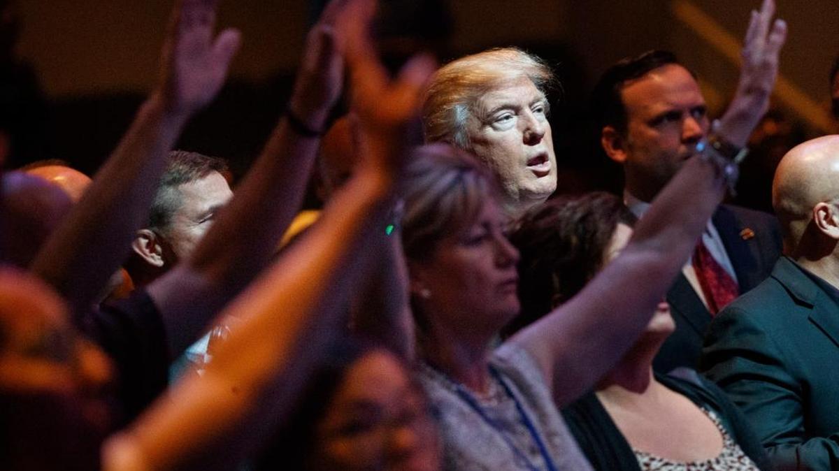 FILE- In this Oct. 30, 2016, file photo, Republican presidential candidate Donald Trump stands during a service at the International Church of Las Vegas in Las Vegas. President Trumpâs pledge to scrap limits on church political activity could have sweeping effects that extend beyond his conservative supporters to more liberal congregations, including the black evangelical church that has long helped anchor the Democratic Partyâs electoral machinery. (AP Photo/Evan Vucci, File)