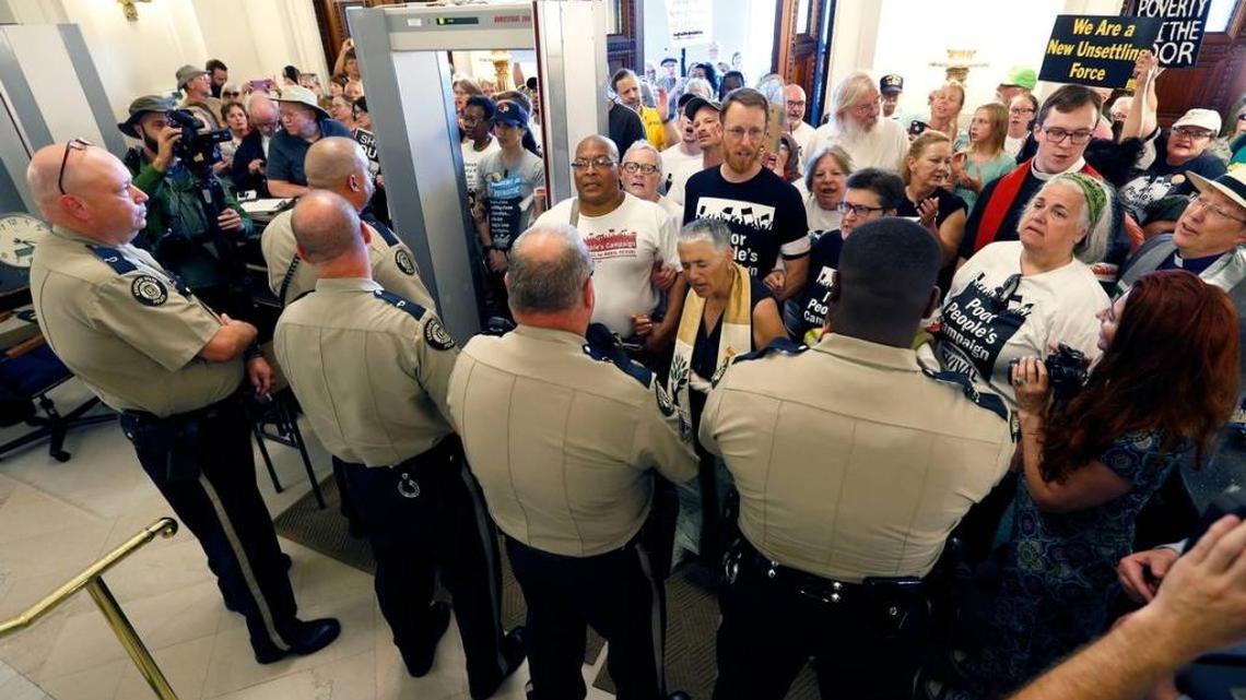 After being told the entire group would not be granted access to the Capitol, the Kentucky Poor Peoples’ Campaign gathered June 12 in the front lobby as police formed a line to block them.