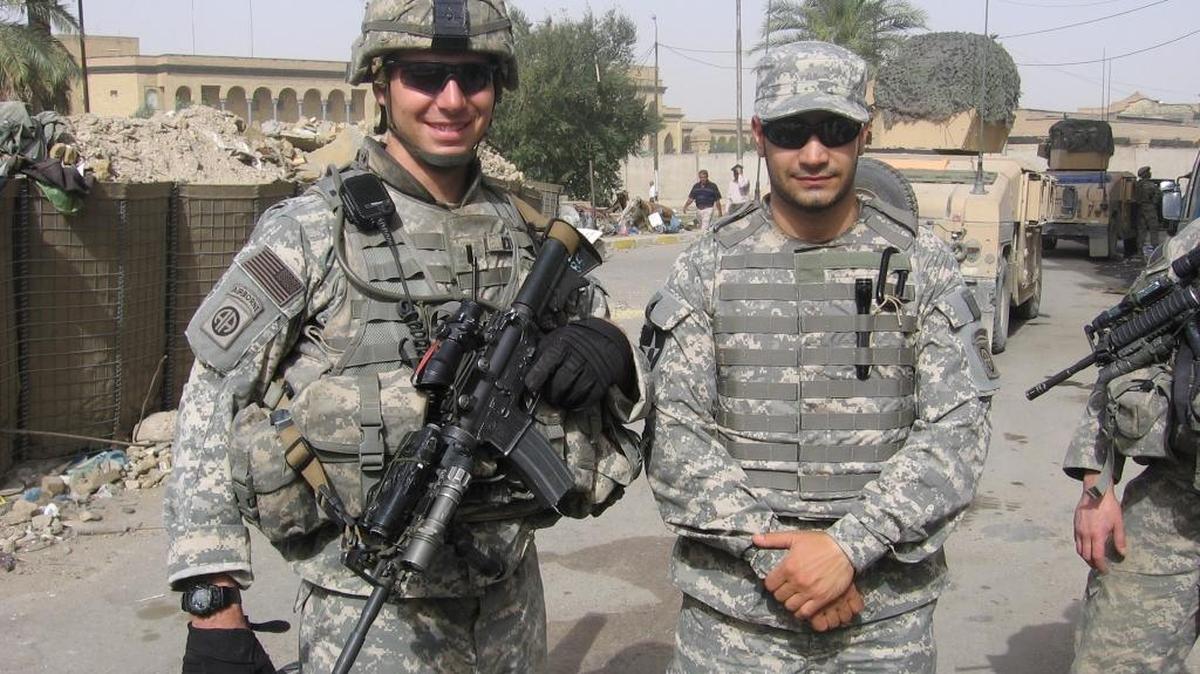 Tyler Scott, of Georgetown, left, is a former Airborne Infantry Officer who served with the 82nd Airborne Division in Baghdad from 2007-08. He is pictured with an Iraqi interpreter.