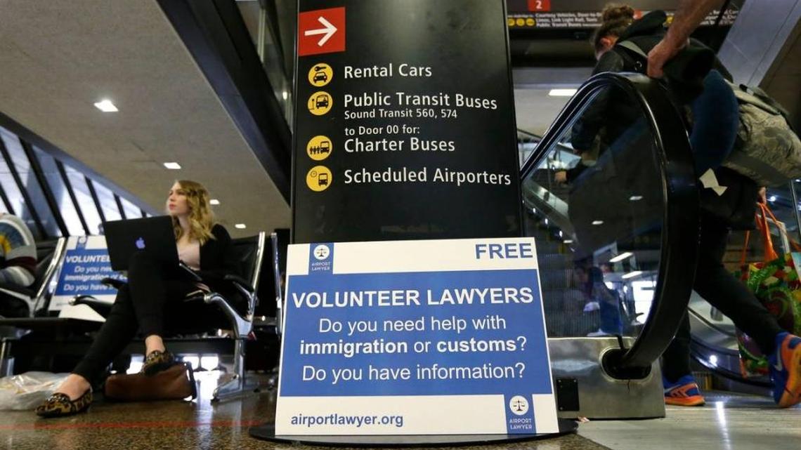 Asti Gallina, left, a law student from the University of Washington, volunteered in February to assist travelers going through customs. The Supreme Court said last month that President Donald Trump’s travel ban on visitors from Iran, Libya, Somalia, Sudan, Syria and Yemen can be enforced if those visitors lack a “credible claim of a bona fide relationship with a person or entity in the United States.” Justices will hear full arguments in October.