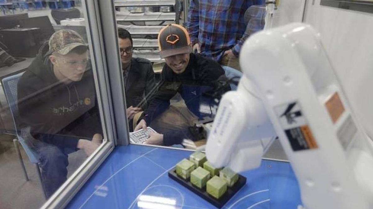 In January, students at Bluegrass Community and Technical College Advanced Manufacturing Center in Georgetown practiced operating a robot which uses suction to move objects.