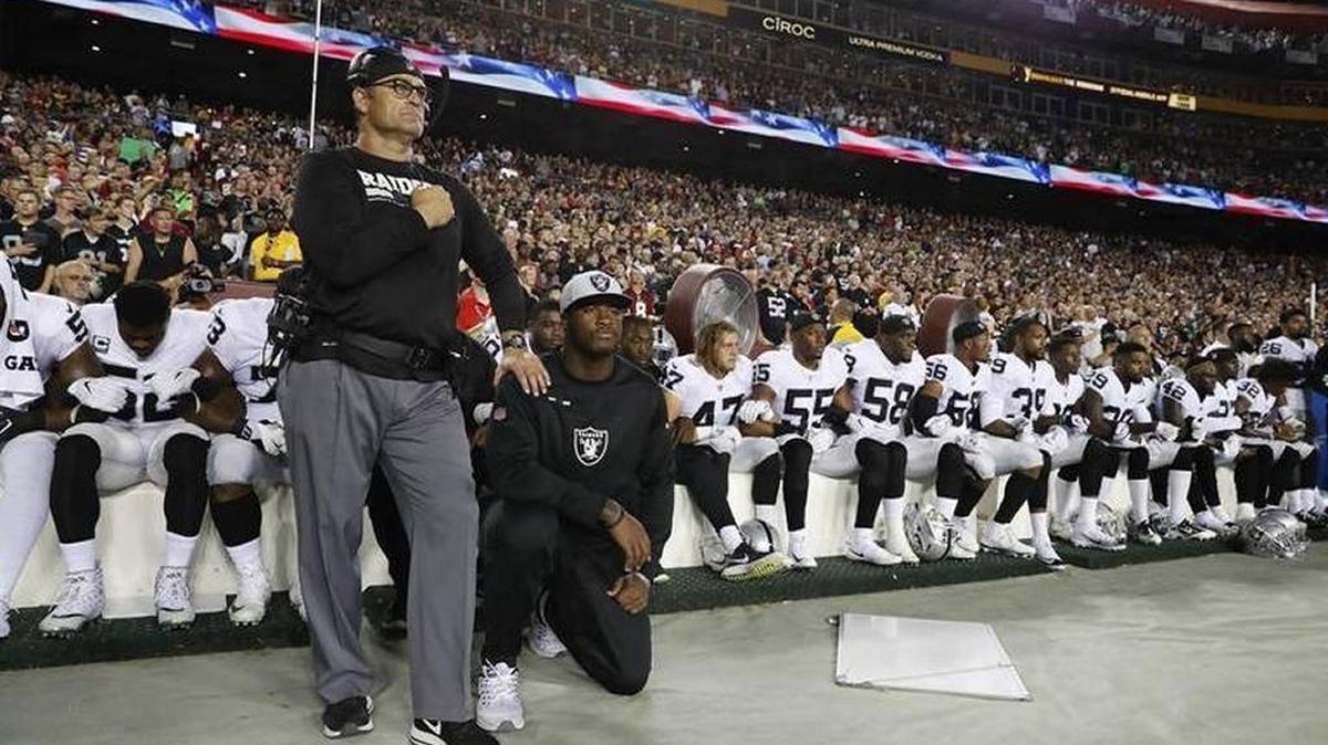 Some members of the Oakland Raiders kneel during the playing of the national anthem before an NFL game against the Washington Redskins in September.