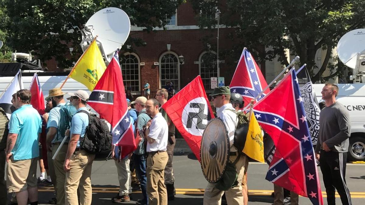 Confederate and Nazi flags waved side by side at Charlottesville rally that resulted in three deaths.