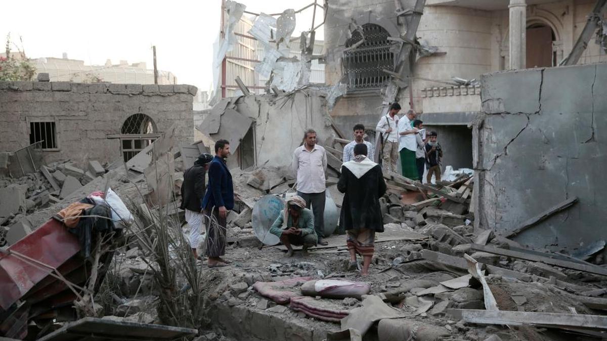 People inspected the damage of houses destroyed by Saudi-led airstrikes in Sanaa, Yemen on Jun. 9. Three siblings and their grandmother were killed.