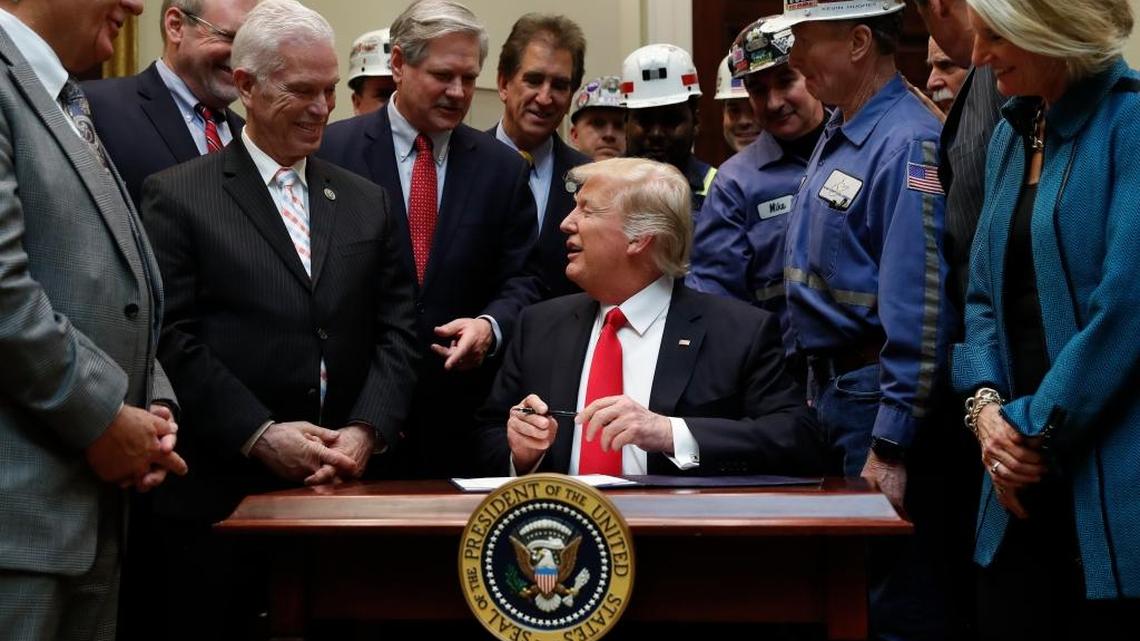 President Donald Trump, joined by coal miners and members of Congress, signed on Thursday a resolution overturning the recently enacted Stream Protection Rule.