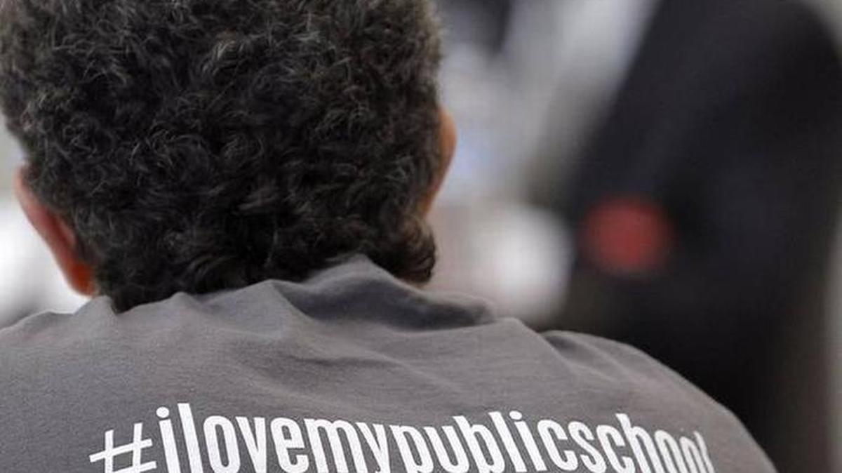 An educator’s shirt during a town hall meeting about the state pension crisis in the cafeteria at Frederick Douglass High School in Lexington