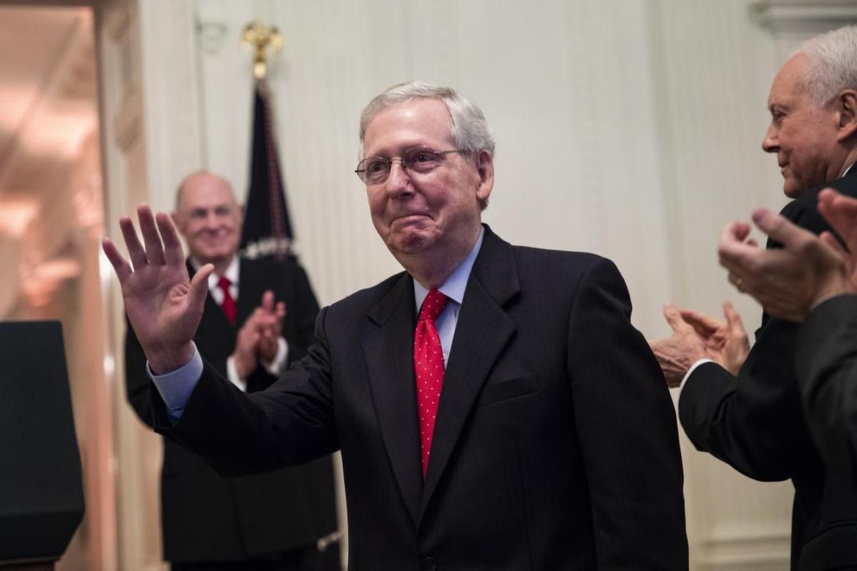 Senate Majority Leader Mitch McConnell received applause Monday as President Donald Trump spoke before Supreme Court Justice Brett Kavanaugh was ceremonially sworn in the White House.
