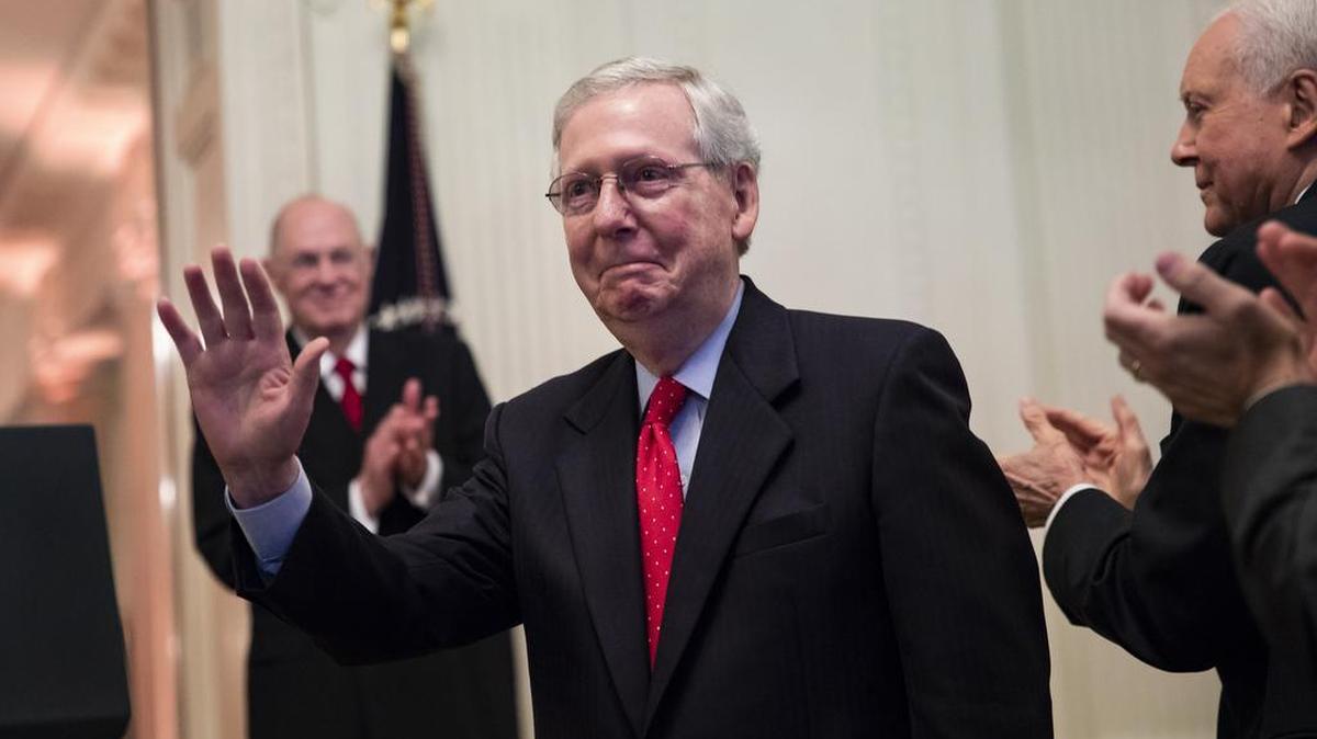 Senate Majority Leader Mitch McConnell received applause Monday as President Donald Trump spoke before Supreme Court Justice Brett Kavanaugh was ceremonially sworn in the White House.