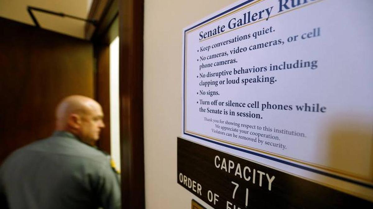 New signs are posted by the gallery in the Senate chambers of the Kentucky Capitol.