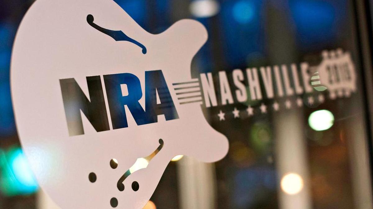 Signage for the 2015 National Rifle Association meeting on the door at the Music City Center in Nashville.