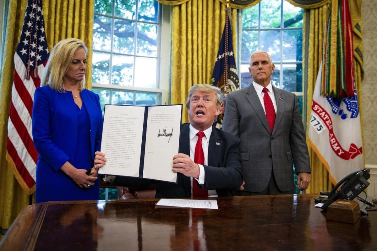 President Donald Trump, with Homeland Security Secretary Kirstjen Nielsen and Vice President Mike Pence, signed an executive order in June of last year to end family separations at the border after public and congressional opposition.