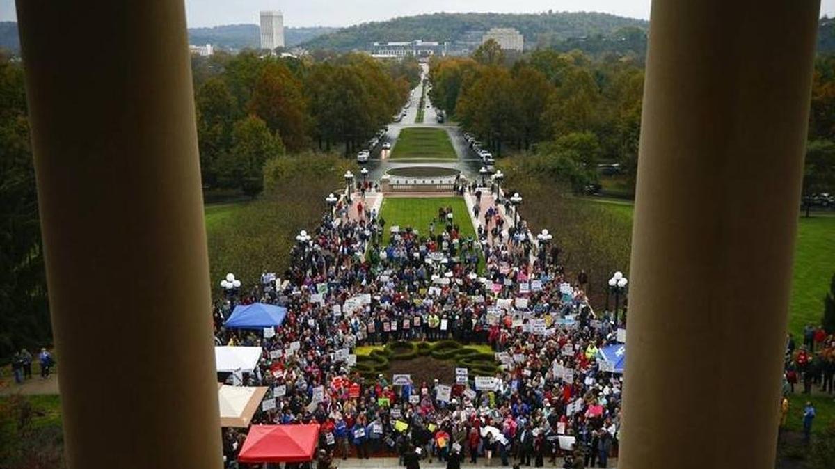 Hundreds of people gathered during a Nov. 1 rally against the Republican proposal to reform the state’s pension system outside of the Capitol in Frankfort.