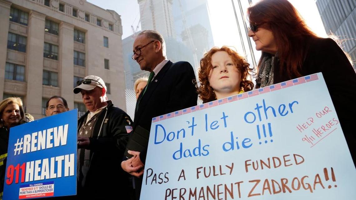 Jack McNamara, 9, second from right, held a sign on behalf of his late father during a Dec. 6 rally in New York calling for the funding of the Zadroga Act. John McNamara, who served in the New York Fire Department, worked at the World Trade Center site following the attacks of Sept. 11, 2001 and died in 2009 of cancer. The Act, which funds medical care for 9/11 first-responders, is set to expire.