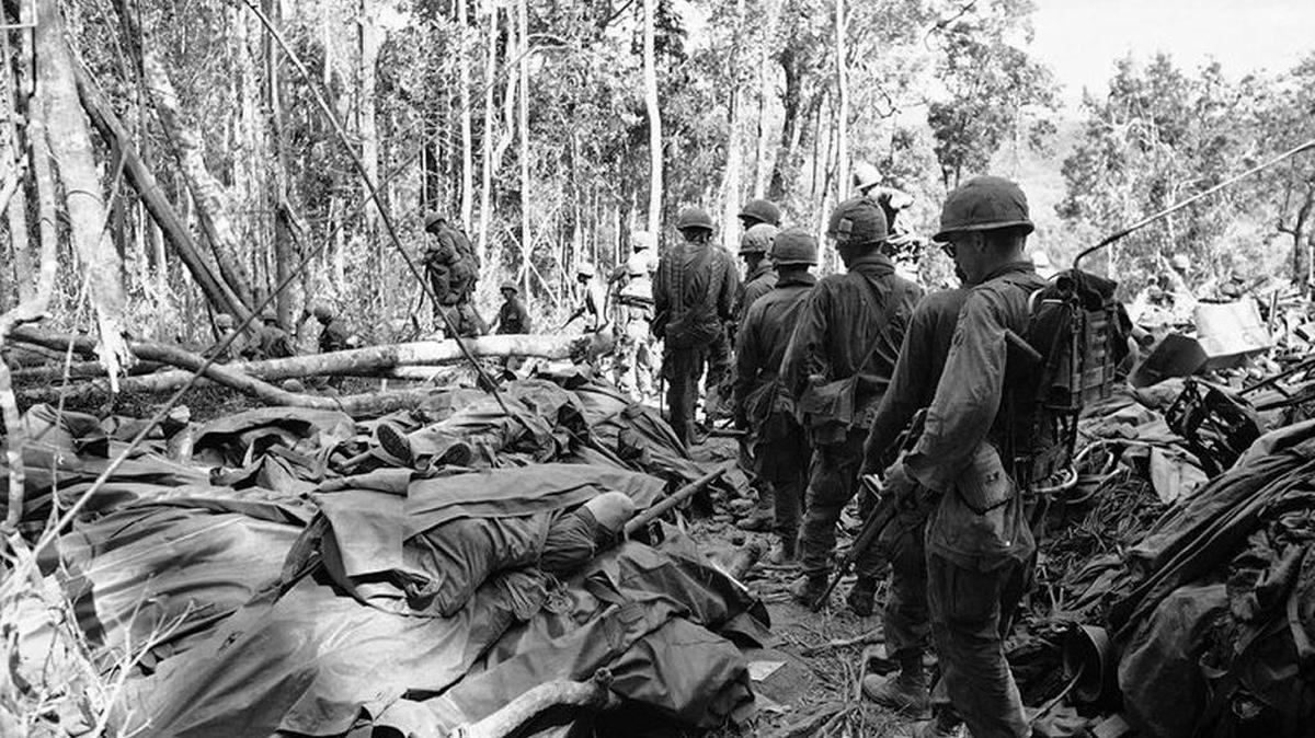 Paratroopers of the 173rd Airborne Brigade filing past bodies of fellow soldiers killed in the Battle of Dak To, in the Tet Offensive.