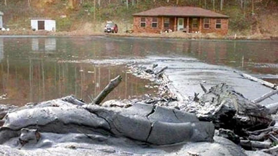 Coal sludge from a Massey Energy impoundment inundated Coldwater Creek, above, and Wolf Creek, tributaries of the Tug Fork, in Martin County in October 2000.