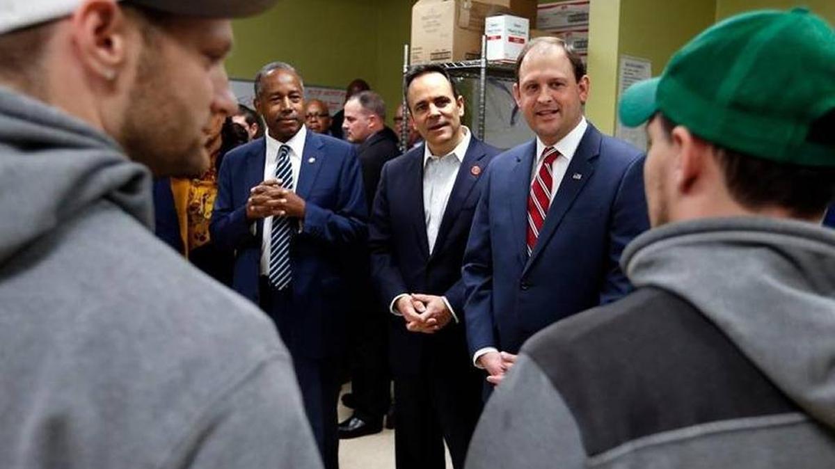 Residents Joshua Noe, left, and Zach Marksbury, right, spoke with U.S. Department of Housing and Urban Development Secretary Ben Carson, Gov. Matt Bevin and U.S. Rep. Andy Barr in the kitchen as as they toured the Hope Center’s Recovery for Men Program at the George Privett center in Lexington on Jan. 25.
