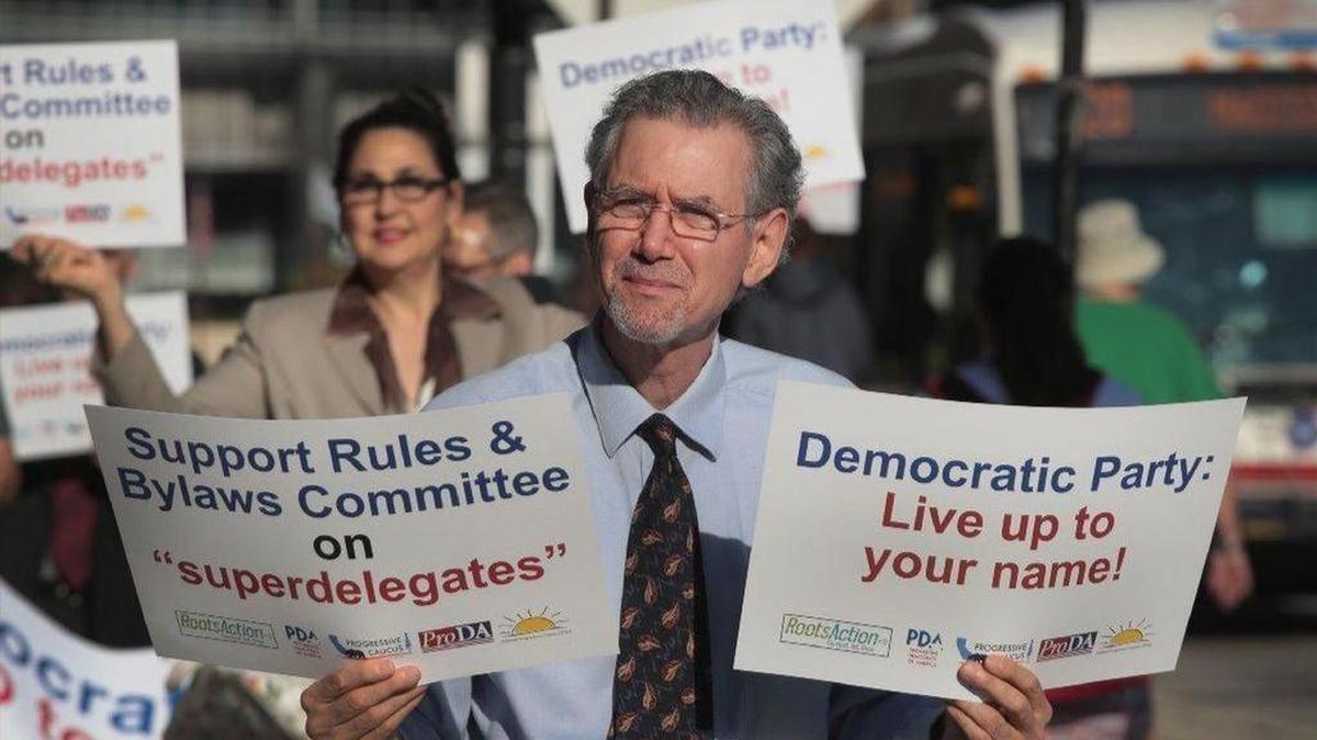 Democrats protested before a vote during a Chicago meeting to reduce the power of superdelegates in selection of the party’s nominee.