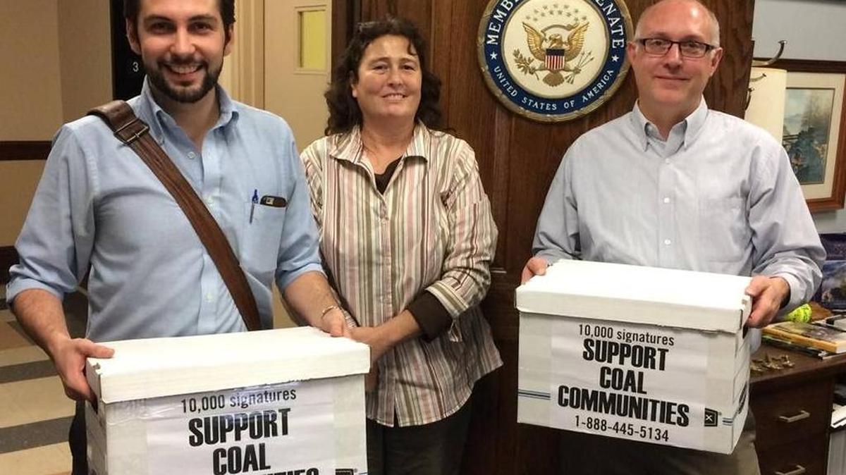 Left to right, Eric Dixon, Katie Dollarhide and Brad Shepherd, all with Kentuckians for the Commonwealth, in December dropped off petitions with 10,000 signatures supporting the RECLAIM Act at U.S. Sen. Mitch McConnell’s office in London.
