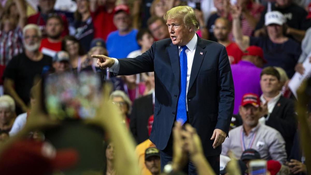 President Donald Trump was cheered at a rally in Southaven, Miss., Tuesday night, when he sharply mocked the woman whose allegation of sexual assault has upended his effort to install a second justice on the Supreme Court.