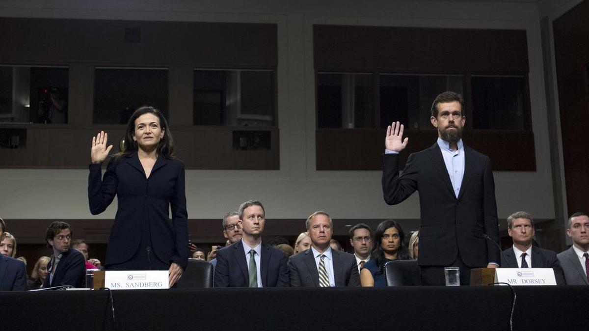 Facebook COO Sheryl Sandberg, left, accompanied by Twitter CEO Jack Dorsey are sworn in Wednesday before the Senate Intelligence Committee hearing on “Foreign Influence Operations and Their Use of Social Media Platforms.”