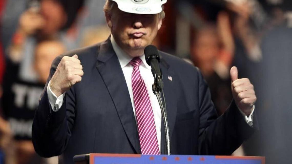 President-elect Donald Trump put on a miners hard hat during a rally May 5 in Charleston, W.Va., where he promised to put coal-miners back to work.
