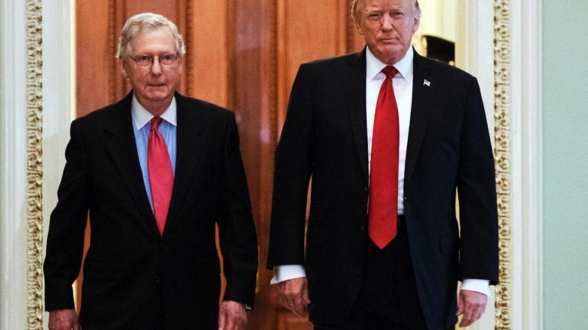 President Donald Trump, escorted by Senate Majority Leader Mitch McConnell, R-Ky., arrives on Capitol Hill to have lunch with Senate Republicans and push for his tax reform agenda, in Washington, Tuesday, Oct. 24, 2017.