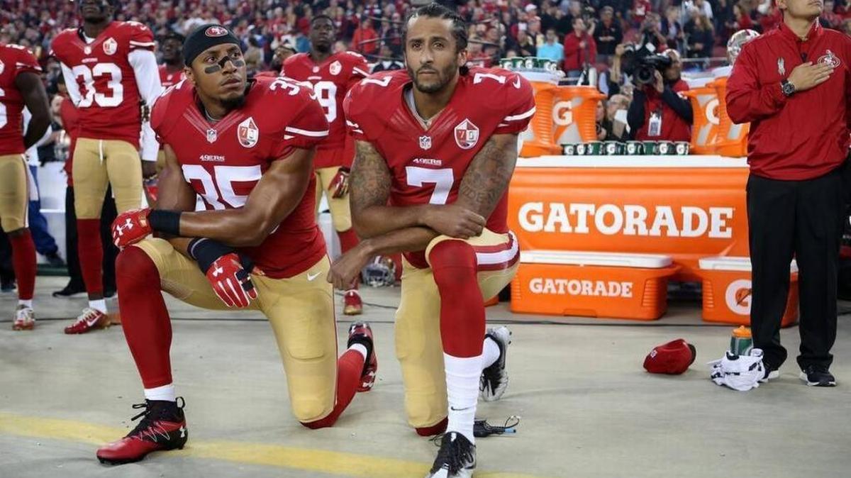 Colin Kaepernick (7) and fellow San Francisco 49er Eric Reid (35) protested racial injustice by taking a knee during the National Anthem prior to an NFL game last season.