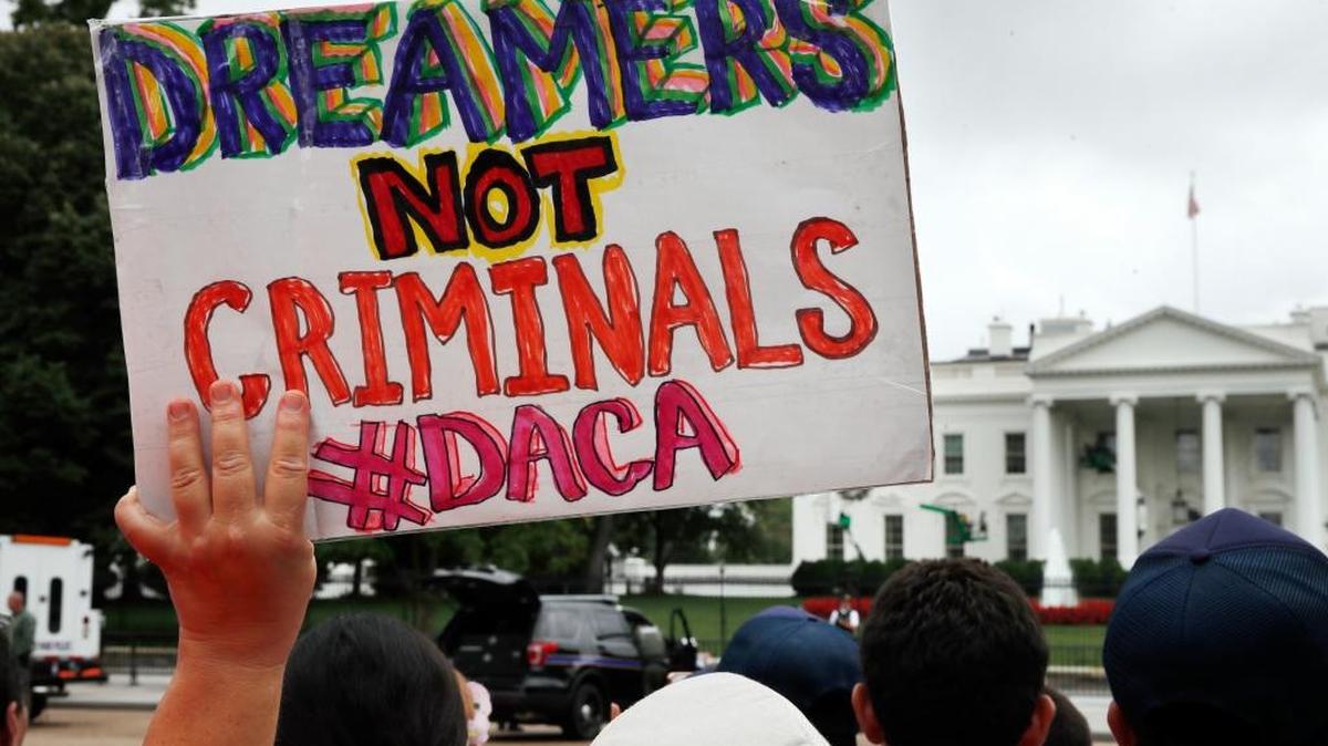 A woman held up a sign in support of the Obama administration program known as Deferred Action for Childhood Arrivals during an August immigration reform rally at the White House.