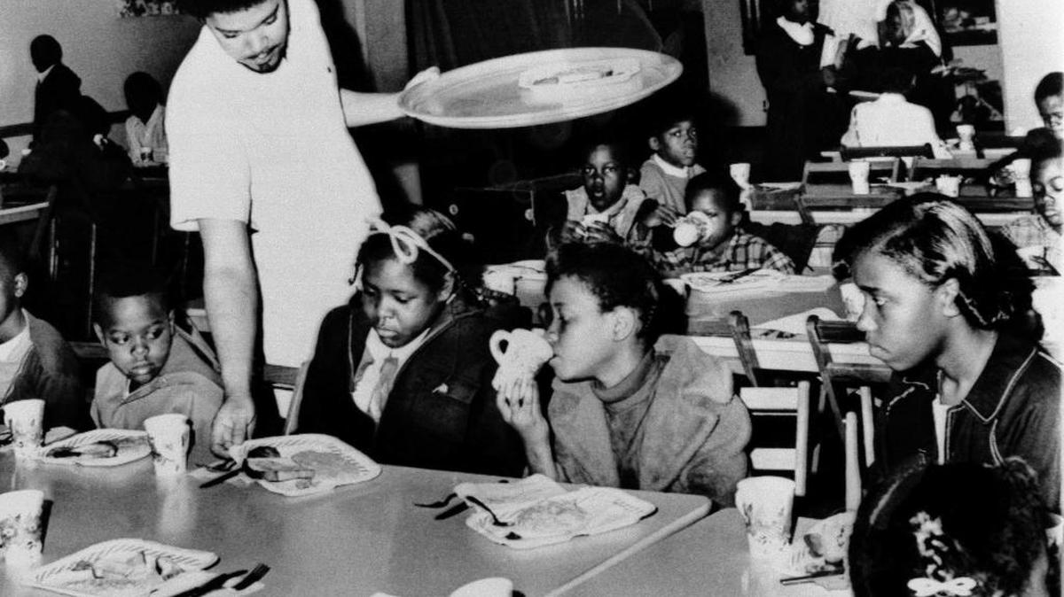 In this April 16, 1969 file photo, Bill Whitfield, member of the Black Panther chapter in Kansas City, served free breakfast to children before they went to school. Hundreds of former Black Panthers from around the world gathered in Oakland, Calif. this weekend to celebrated the organization’s founding 50 years ago.