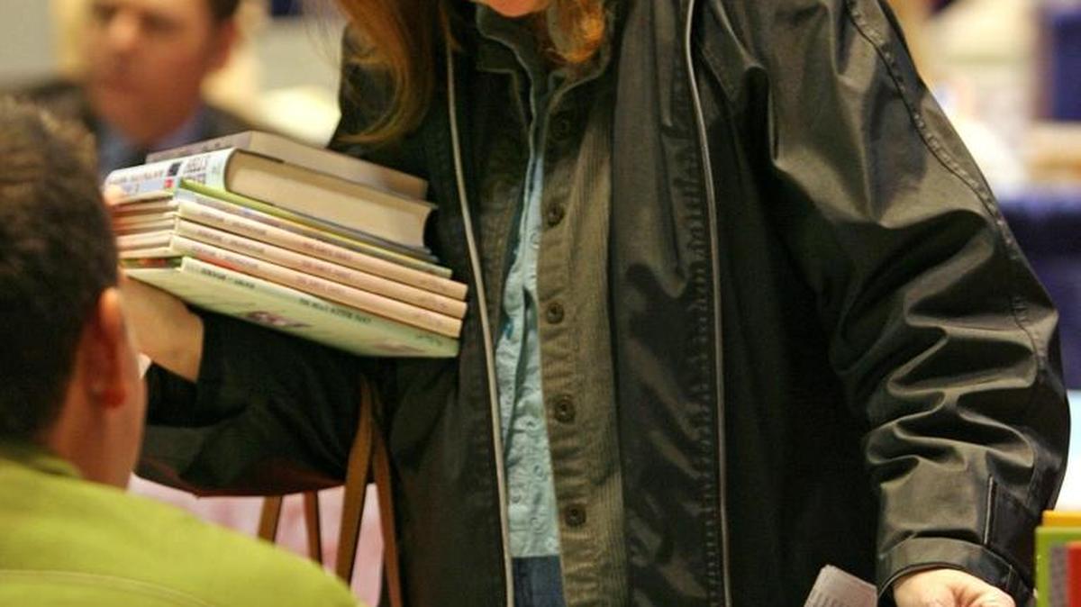 A participant delighted in her literary choices during the 2010 Kentucky Book Fair.