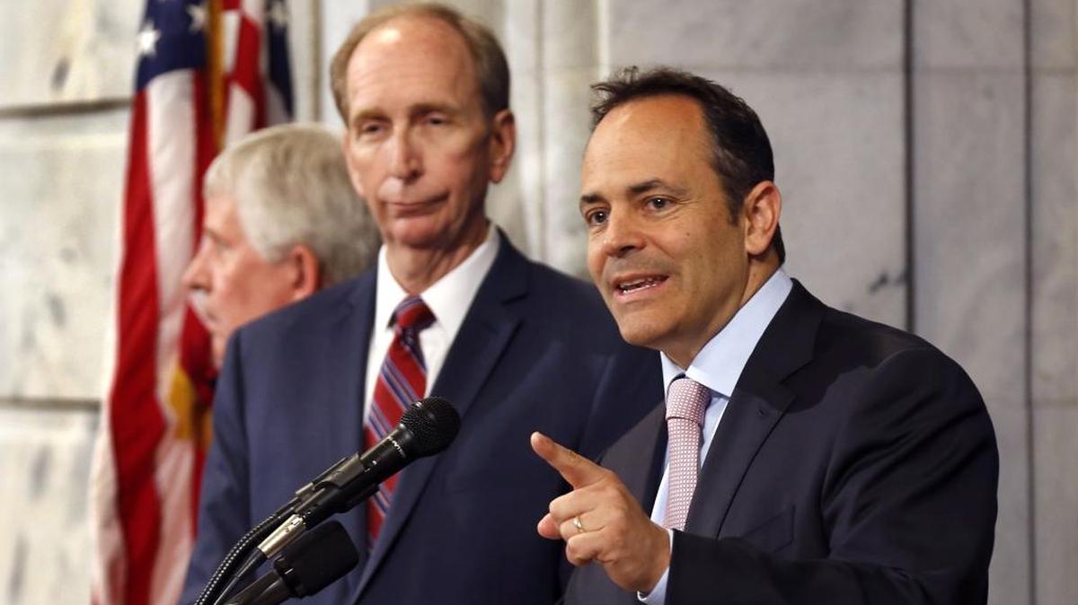 Gov. Matt Bevin, right, unveiled details of his plan to overhaul Medicaid at a news conference in Frankfort. On the left is Mark D. Birdwhistell, a former Secretary of the Cabinet for Health and Family Services, who assembled a team of experts to assist in the drafting of a Medicaid waiver. Bevin said his plan, which he says will save taxpayers $2.2 billion over the next 5 years, focuses on creating better health outcomes and personal responsibility for participants, and sustainability for the costly health insurance program that serves the poor and disabled.