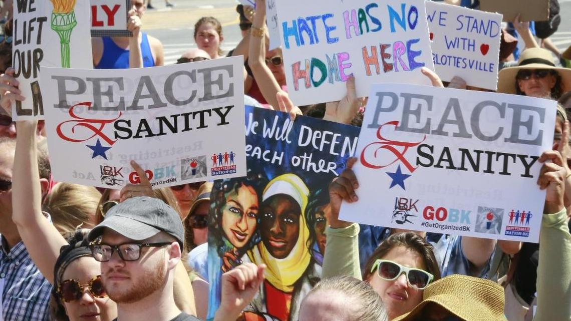 Protesters listen during a “Peace and Sanity” rally Sunday in the Brooklyn, New York, during a rally about white-supremacy violence in Charlottesville, Va.